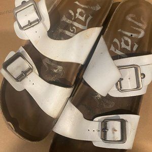 Well worn white strap sandals